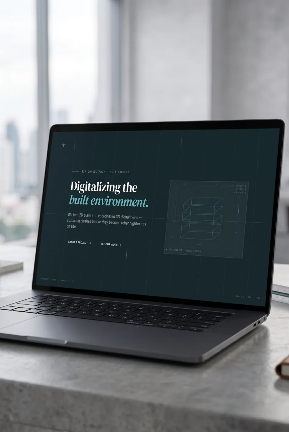 The BIMNovate site open on a laptop in a studio, city beyond the window